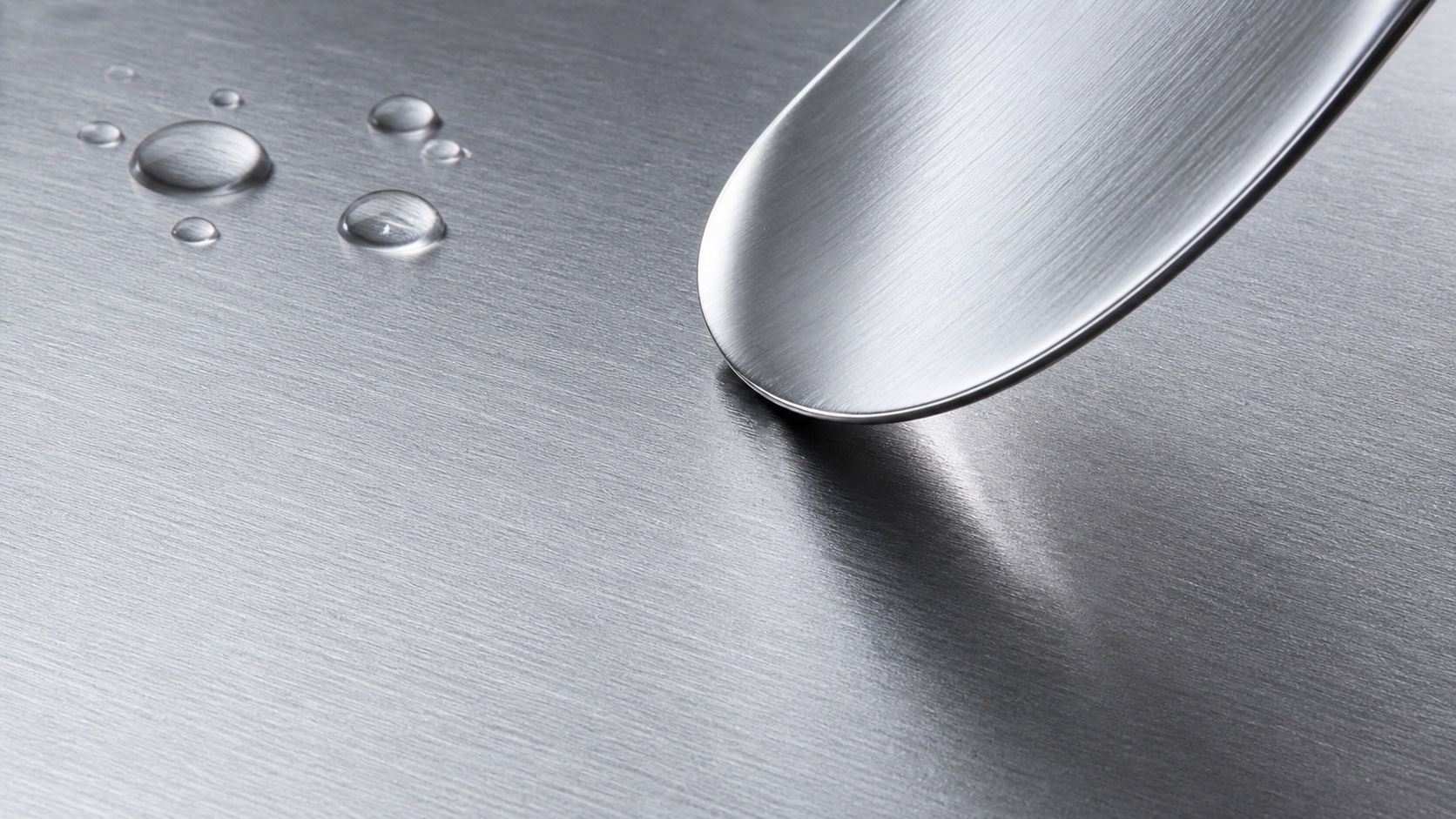 Water droplets on dense scratch-resistant steel surface